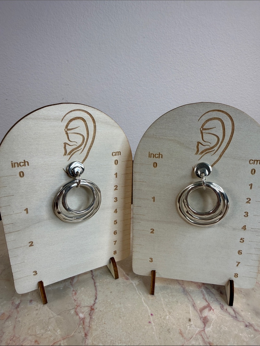 One of 50 Silver Double Hoop Drop Earrings